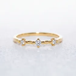 Trilogiering met Gespreide Diamanten in 18K Goud | Celinni