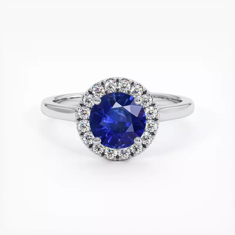 Anneau de saphir bleu avec halo de diamants