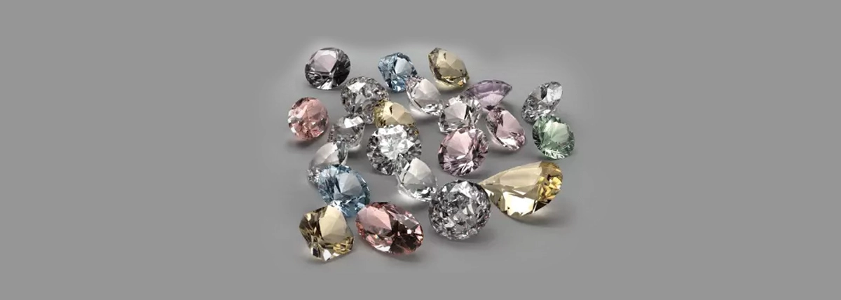 A collection of colored diamonds, including pink, blue, yellow, and red stones, showcasing the diversity of rare diamonds.