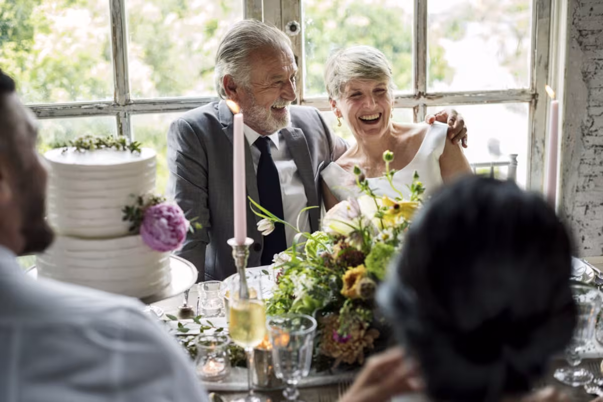 Couple celebrating their sable wedding anniversary surrounded by loved ones, illustrating an elegant and emotional celebration to mark 54 years of marriage.
