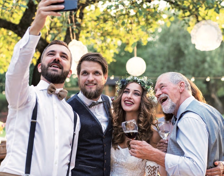 Newlyweds sharing a moment with close family and friends after the ceremony, illustrating a sincere and personalized wedding thank-you