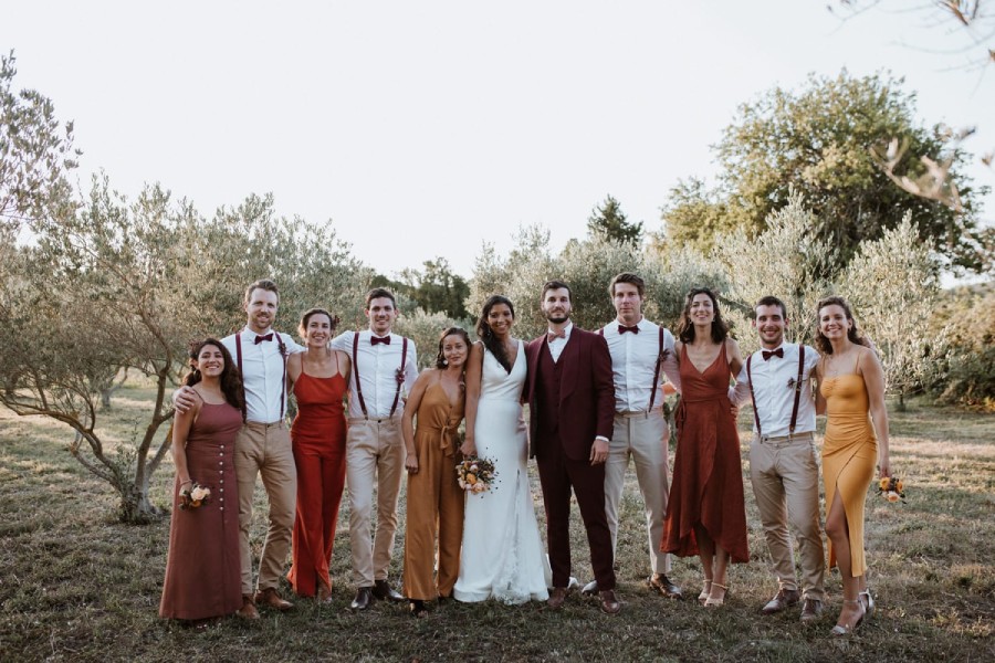 Newlyweds surrounded by their guests at an outdoor wedding, symbolizing gratitude and heartfelt thanks after the wedding