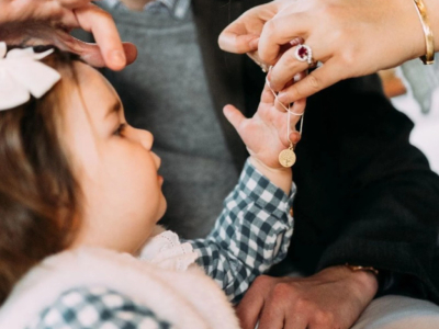 Who Gives the Baptism Medal and Chain?
